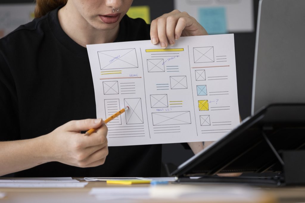 female web designer explaining website structure